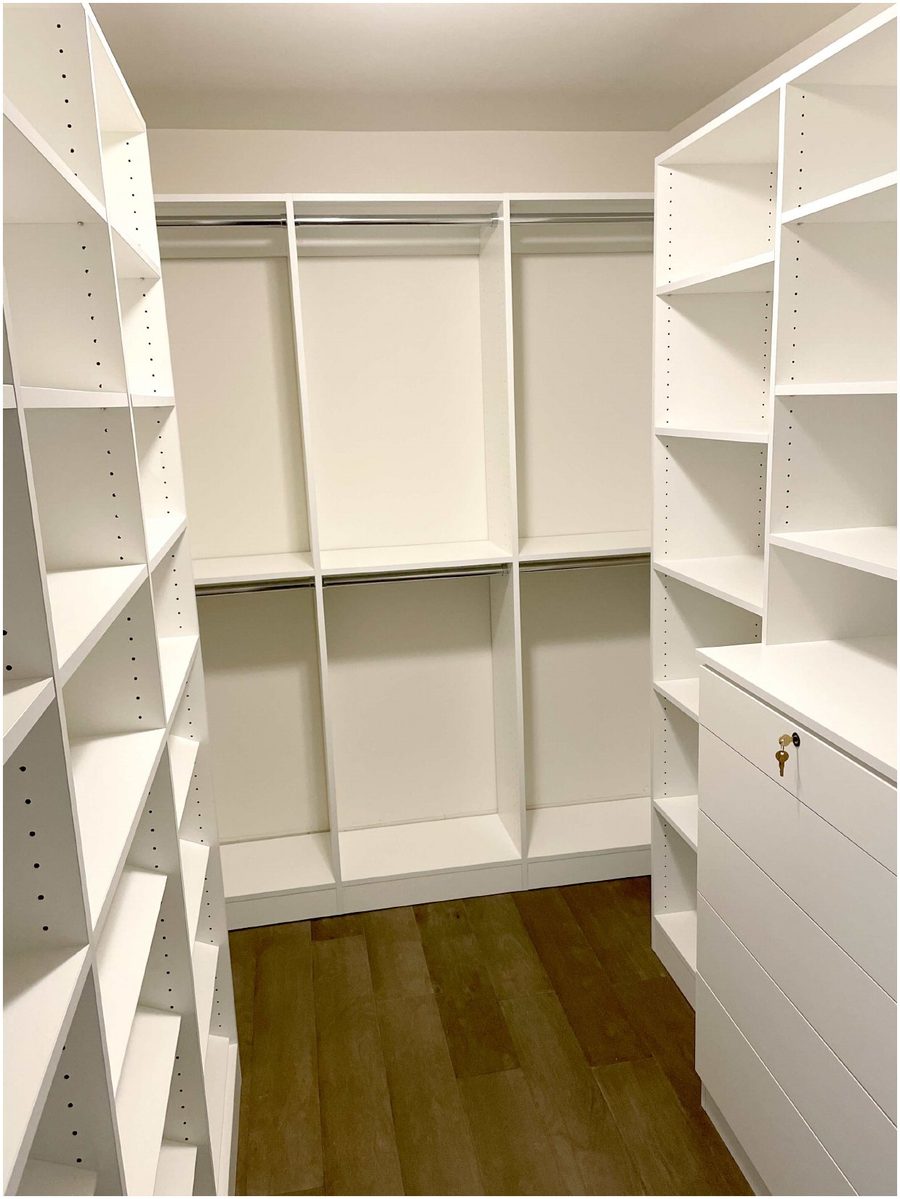 Custom walk-in closet with hanging rods and shelving system installed by Shelf in Newburgh NY